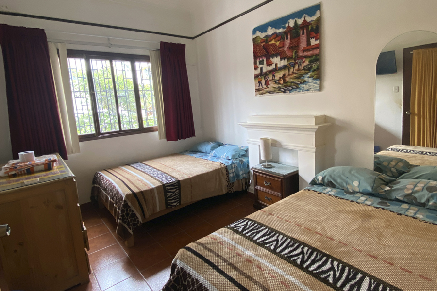 Room with two double bed & private bathroom outside room